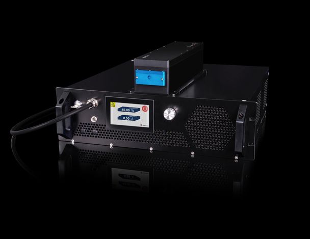 The image depicts a high-power infrared fiber laser amplifier from TOPTICA. The device has a sleek, black, rack-mounted design with a prominent digital display on the front panel. The display shows output power (45.00 W) and current (8.50 A). The unit features a large knob, ventilation grills, and an input/output connection port on the front side.